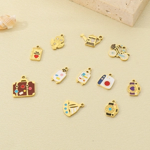Macro detail of assorted 18k gold-plated enamel charms for DIY jewelry making