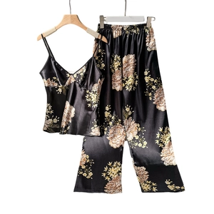 Women's black floral satin pajama set with camisole top and printed trousers