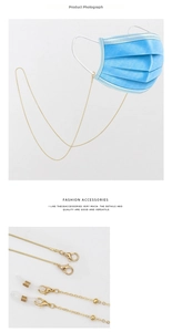 Detail of golden metal chain with lobster clasps and silicone loops for glasses and masks