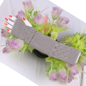 Detailed knit grey arm sleeves featuring hollow-out leaf patterns and ribbed cuffs