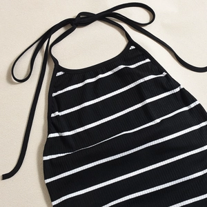 Detail of black and white striped halter neckline with ribbed knit texture detail