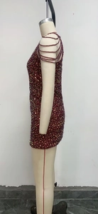 Detailed view of burgundy sequin mini dress featuring multi-layer beaded shoulder straps