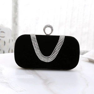 Elegant black velvet evening clutch with rhinestone chain tassel and crystal ring closure