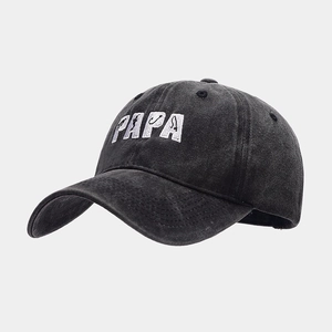 Close-up of PAPA fishing themed embroidery on charcoal washed cotton baseball cap