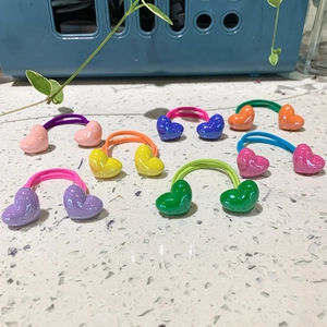 Close-up of colorful heart-shaped candy color hair ties in various vibrant pastel shades