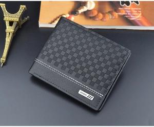 Detail of black plaid texture and silver brand logo on a leather bifold wallet