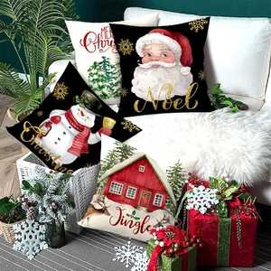 Set of 4 Christmas throw pillow covers with Santa and snowman on white sofa