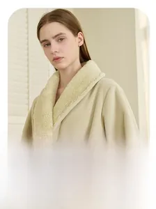 Detail of soft beige flannel bathrobe with thick white sherpa fleece shawl collar