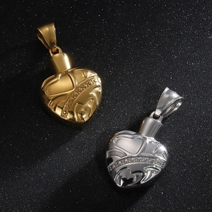 Vintage stainless steel heart pendants in gold and silver with embossed patterns