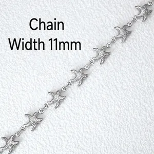 Macro detail of silver stainless steel starfish DIY chain with 11mm width and 5# model size