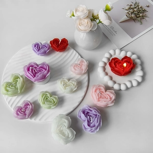 Ins style heart-shaped rose scented candles in various colors on a white tray