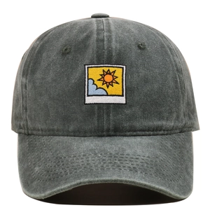 Detailed embroidery patch of sun and clouds on a washed cotton grey baseball cap