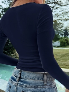Back view of sexy slim fit navy V-neck long sleeve Y2K top with star detail
