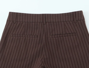Detailed view of dark brown pinstripe suit trousers with back pockets and belt loops