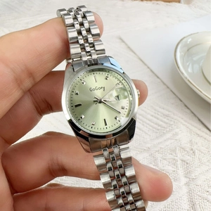 Classic silver steel strap watch with light green dial and date window for women