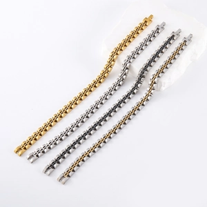 Detail of four industrial stainless steel bracelets in gold, silver, bicolor and black