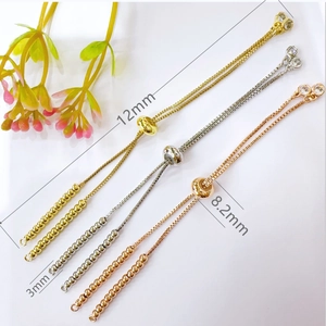 Macro shot of adjustable gold-plated beads bracelet chains with sliding claps for DIY jewelry