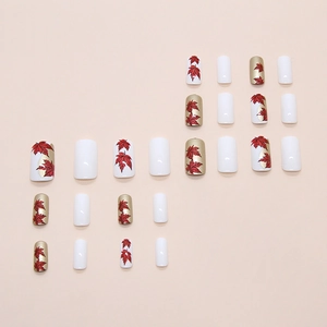 Pearly red maple leaf square press-on nails set with gold and white accents