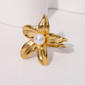 Minimalist gold flower ring with pearl inlay and polished stainless steel finish