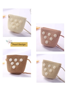 Detail of four colorful mini straw bucket bags for girls with elegant pearl decorations