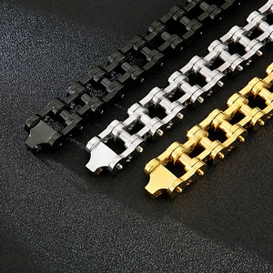 Detailed view of heavy industrial stainless steel bike chains in black silver and gold