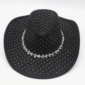 Close-up of black denim cowboy hat with sparkling rhinestones and crystal hatband