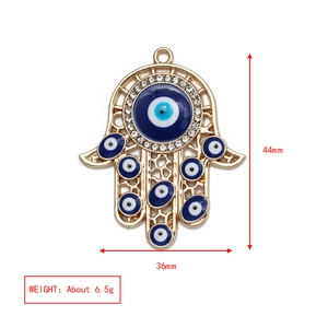 Hamsa Hand pendant detail with blue Evil Eye and dimensions 44mm by 36mm