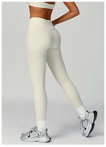Macro detail of high-waisted recycled yoga leggings in ivory with seamless stitch finish