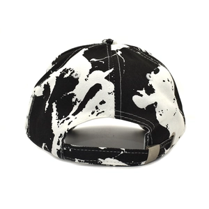 Detail view of tie-dye baseball cap back with adjustable metal buckle and marble print