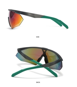 Detail of matte black and green sports sunglasses with red-orange mirrored lenses