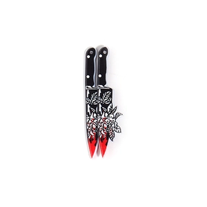 Detailed close-up of acrylic Halloween pendants featuring floral patterns and bloodstains