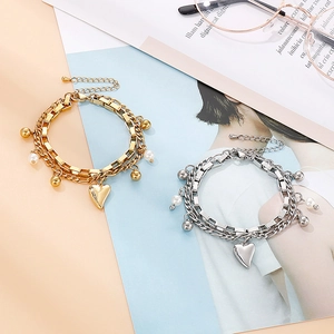 Bracelet double rang avec pendentif cœur, perles et billes en tons or et argent