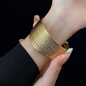 Luxurious multi-layer gold plated open cuff bracelet with fine spiral metal texture