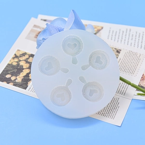 Round white silicone mold with five heart-shaped slots for chocolate and resin DIY crafts