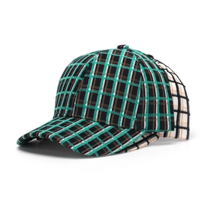 Detail of multi-color plaid baseball cap showing green and black woven texture
