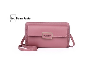 Detail of red bean paste crossbody phone bag with gold metal plate and fine faux leather
