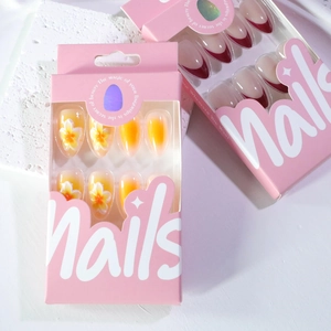 Short almond press-on nails with 3D white flowers, yellow gradient and red French tips