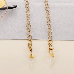 Detailed view of gold link eyewear chain with silicone ends and lobster clasps