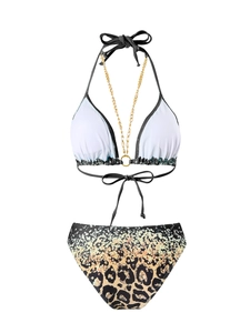 Detail of bikini top with gold chain straps and leopard print bottoms with glitter