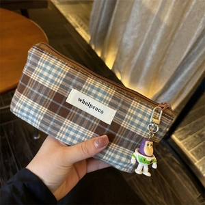 Retro checkered coin purse with blue-white pattern and Buzz Lightyear pendant detail