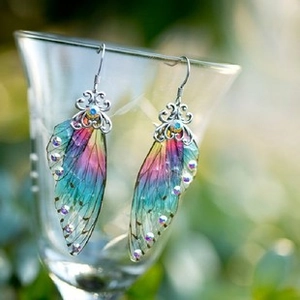 Close-up of S925 silver cicada wing earrings with purple gradient and crystal details