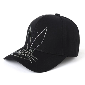 Black cotton baseball cap for women with rhinestone bunny pattern at a 45-degree angle