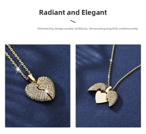 Macro detail of a gold heart locket necklace with zircon pavé opening into wings