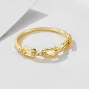 Close-up of golden chain style S925 silver ring with micro-pave white zircon details