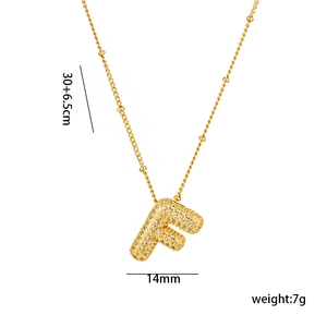 Detail view of 18K gold plated letter F pendant with micro-pave cubic zirconia settings