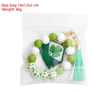 St. Patrick's Day keychain in OPP bag with clover beads and green tassel detail