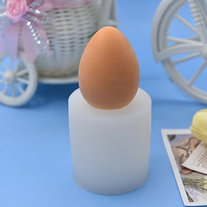 Egg-shaped silicone mold for DIY candles, soaps, and fondant crafts on blue background