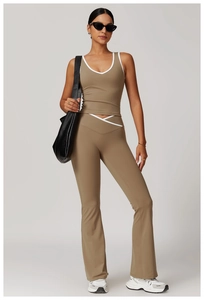 Detail of cross V-waist yoga pants and racerback top with contrast white piping