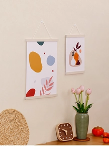 Detail of magnetic wooden poster hanger set with minimalist abstract plant art prints