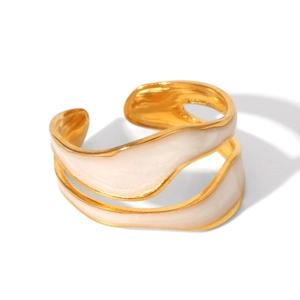Detail of wave-shaped dual layer gold-plated ring with white enamel inlay accents